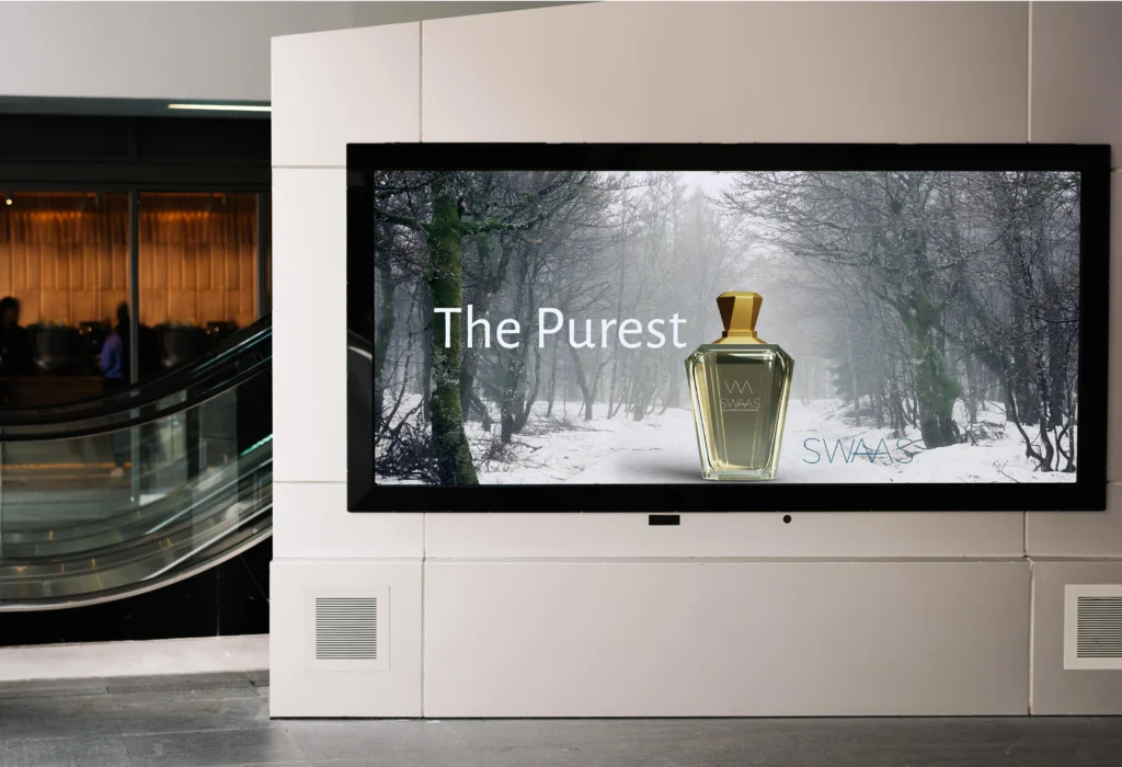 swaas presentation-14-min Variety of Swaas fragrance bottles lined up on a wooden shelf.